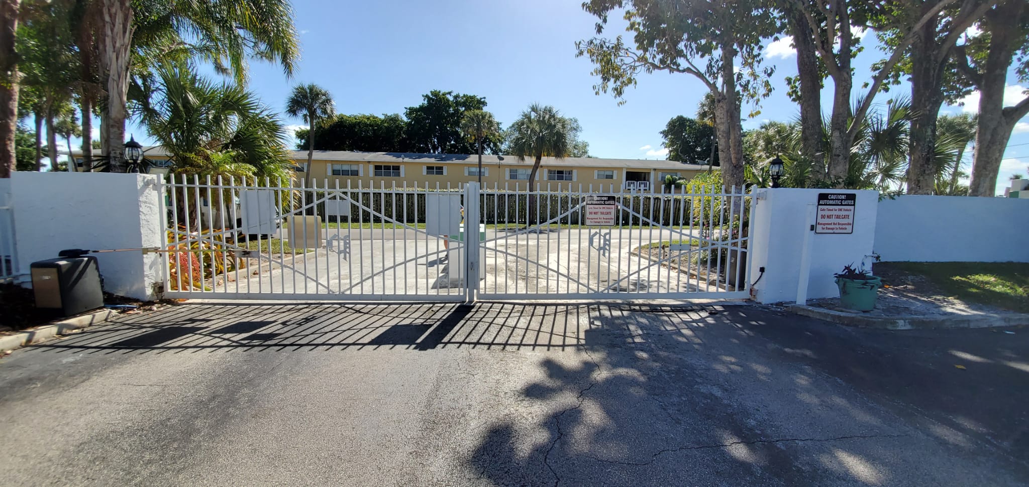 Gate hinge and roller repair on a residential gate in Miami, FL