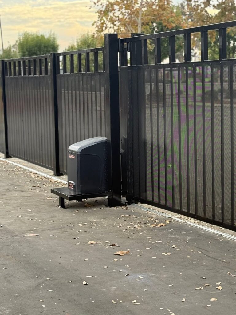 Black aluminum sliding gate with its gate operator